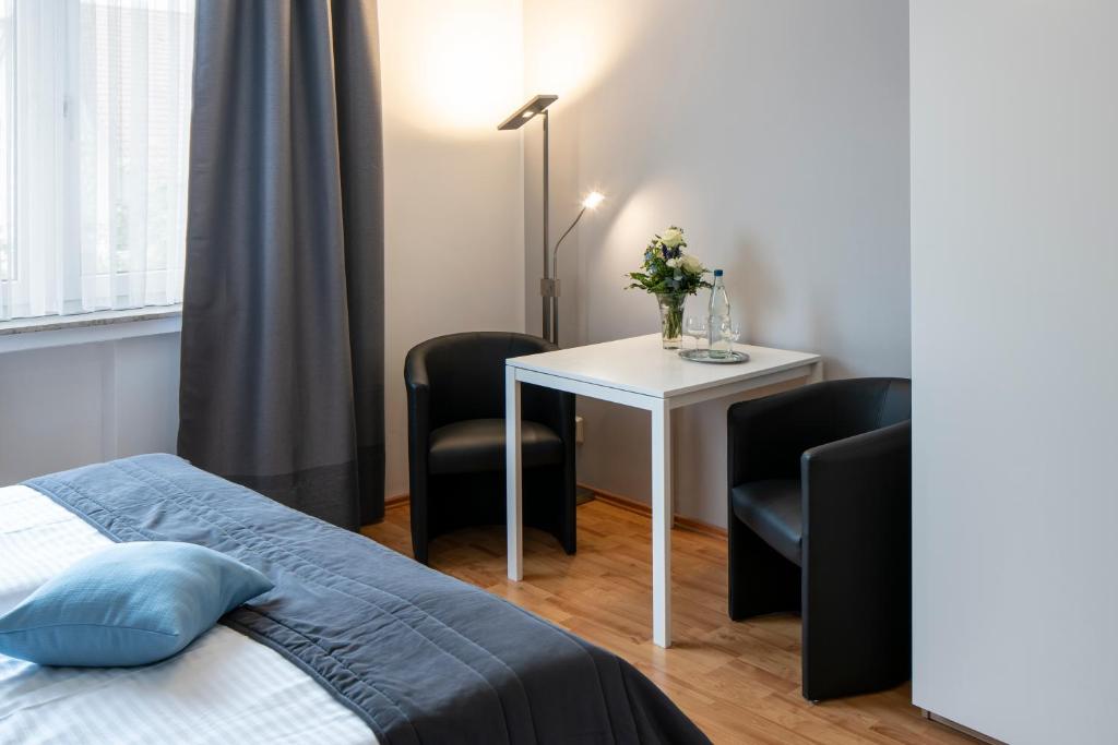Postel nebo postele na pokoji v ubytování Hotel Birkenstern