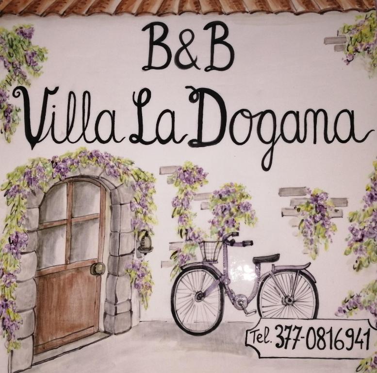ルッカにあるVILLA LA DOGANAのBC Villa deonaを読むサイン付きの壁に自転車