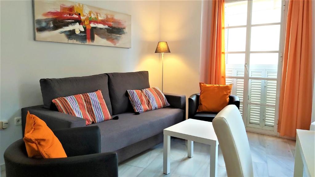 A seating area at APT ALCAZABA by Malaga Picasso Rentals Selection