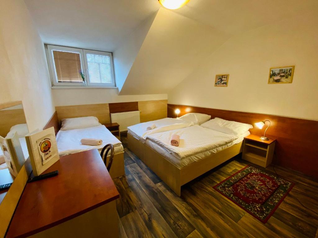 Postel nebo postele na pokoji v ubytování Hotel Restaurant Svejk