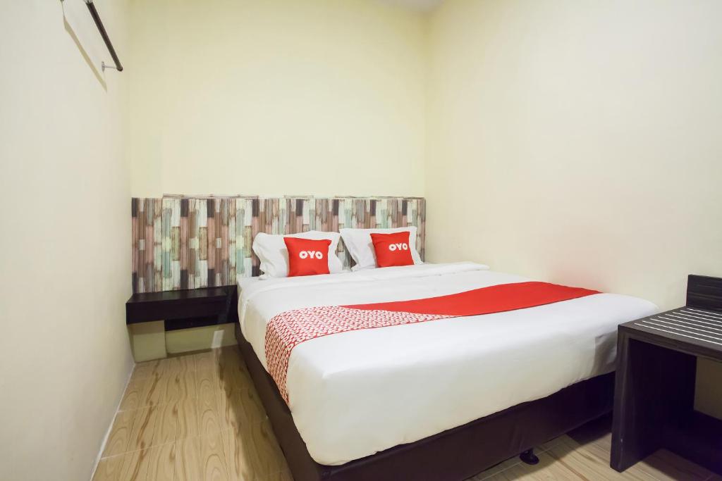 Ένα ή περισσότερα κρεβάτια σε δωμάτιο στο OYO 2361 Hotel Winston