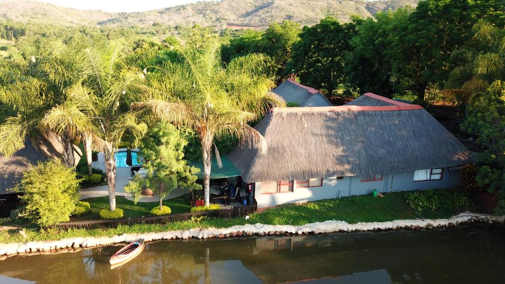 an aerial view of a house with palm trees at Palmwag Tzaneen in Tzaneen