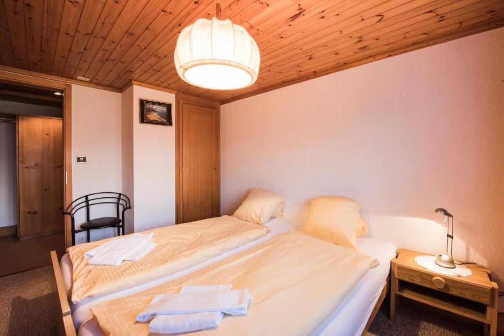 Postel nebo postele na pokoji v ubytování Chalet Bergwelt