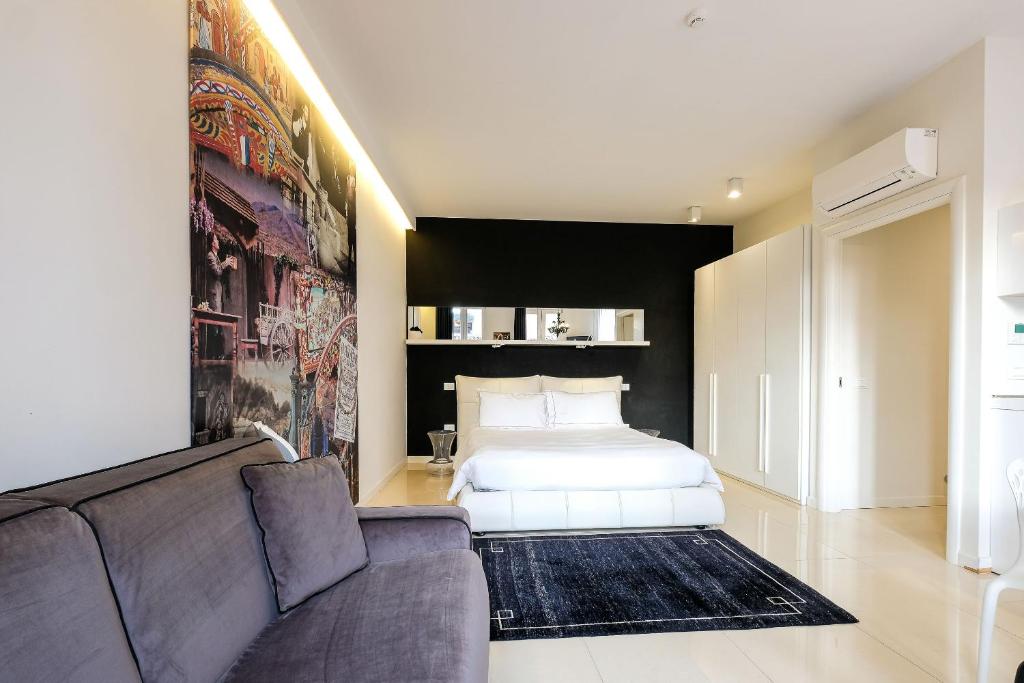 Postel nebo postele na pokoji v ubytování Opera Relais De Charme - Aparthotel
