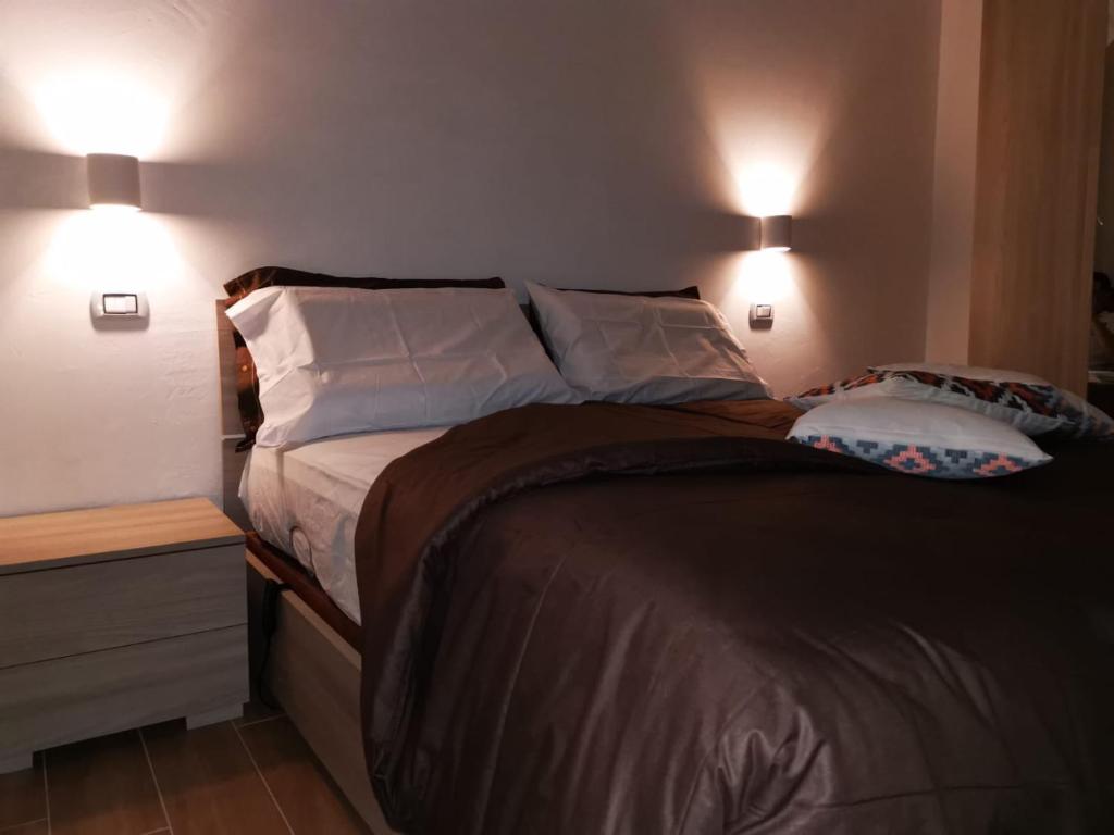 A bed or beds in a room at B&B Belli Dentro