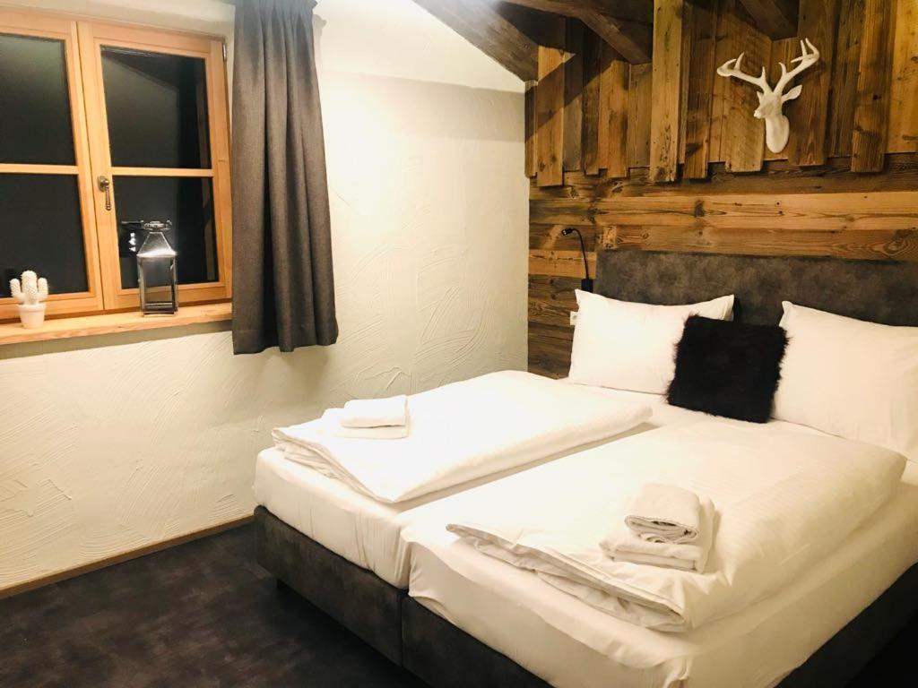 Postel nebo postele na pokoji v ubytování Sieglhub Chalets - Appartements - Hotel