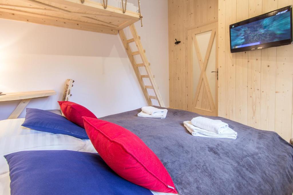 Posteľ alebo postele v izbe v ubytovaní Apartamenty Orkana Centrum Zakopane