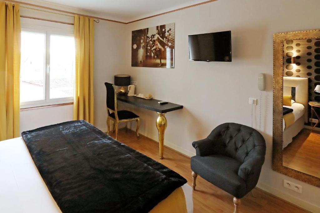 TV o dispositivi per l'intrattenimento presso Hotel Les Pasteliers