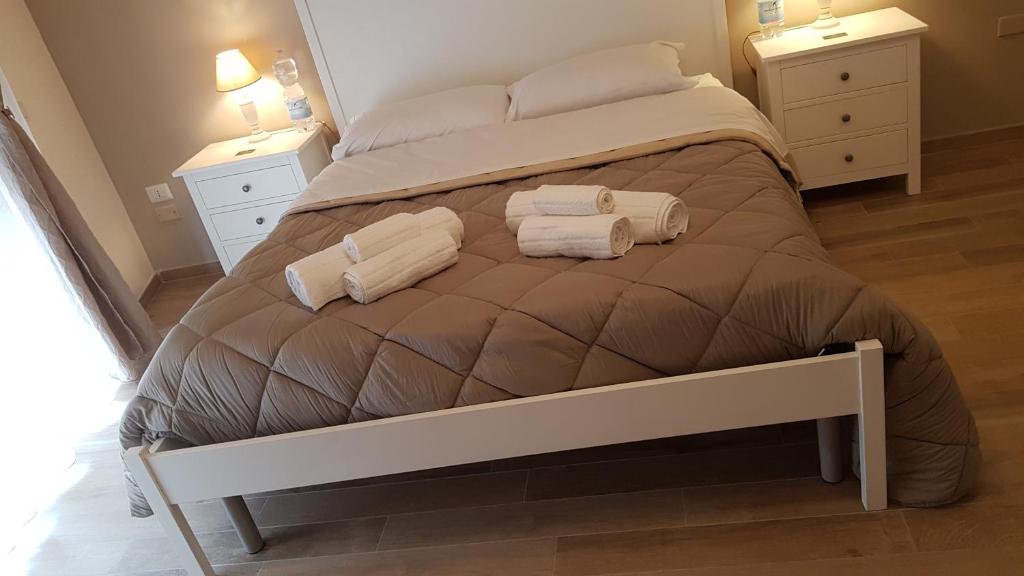 Łóżko lub łóżka w pokoju w obiekcie Royal House