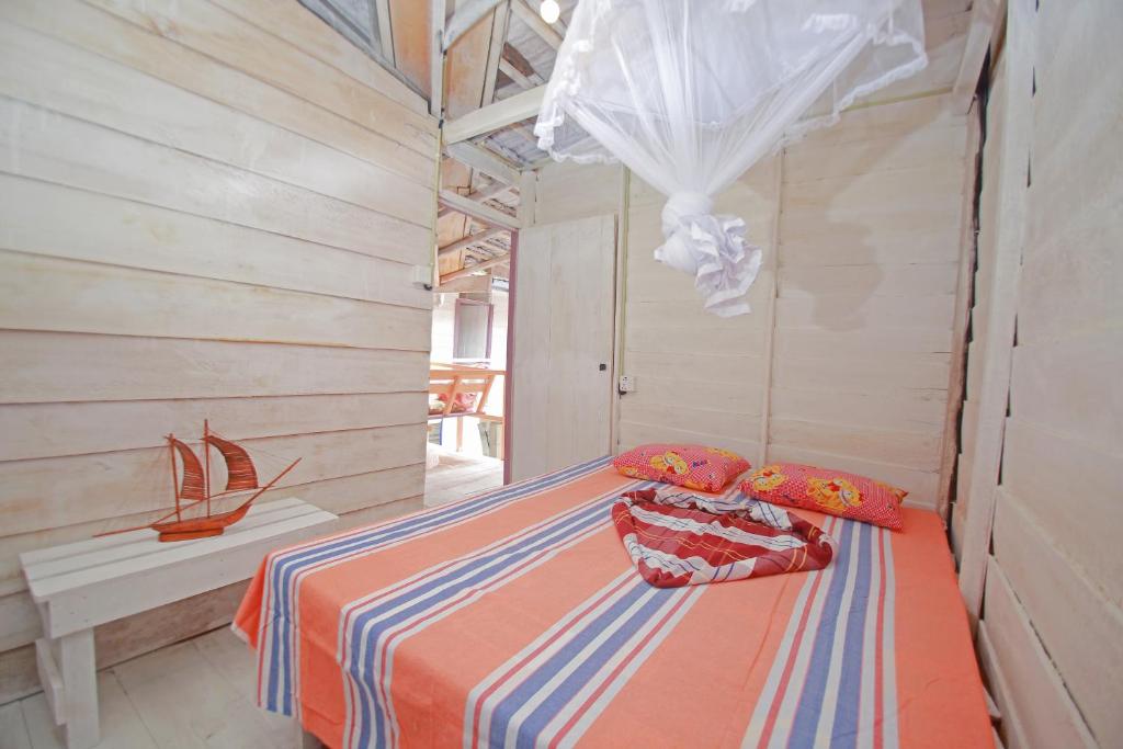 Postel nebo postele na pokoji v ubytování Ceylon Beach Home