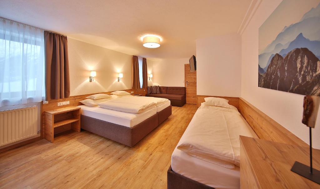 Posteľ alebo postele v izbe v ubytovaní Hotel Garni Fiegl Apart