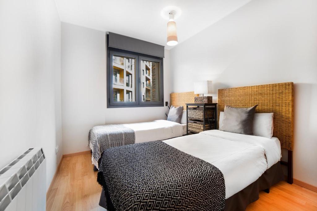 Postel nebo postele na pokoji v ubytování Apartaments El Floc