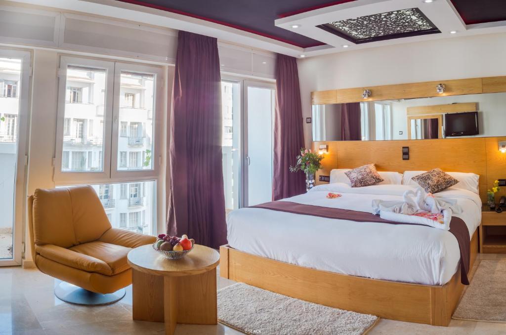 Postel nebo postele na pokoji v ubytování Hôtel Tanjah Flandria