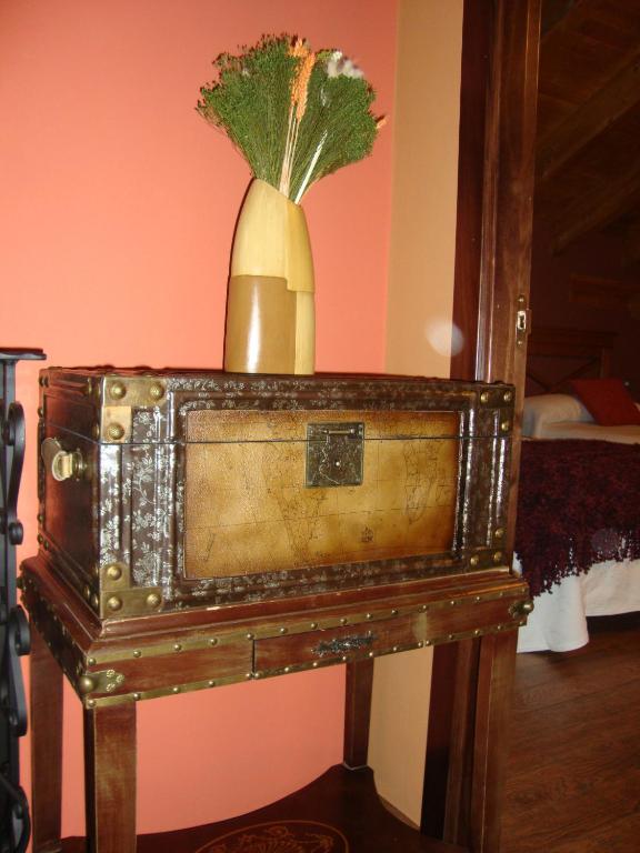 A bed or beds in a room at Apartamentos Rurales Posada de las Hoces