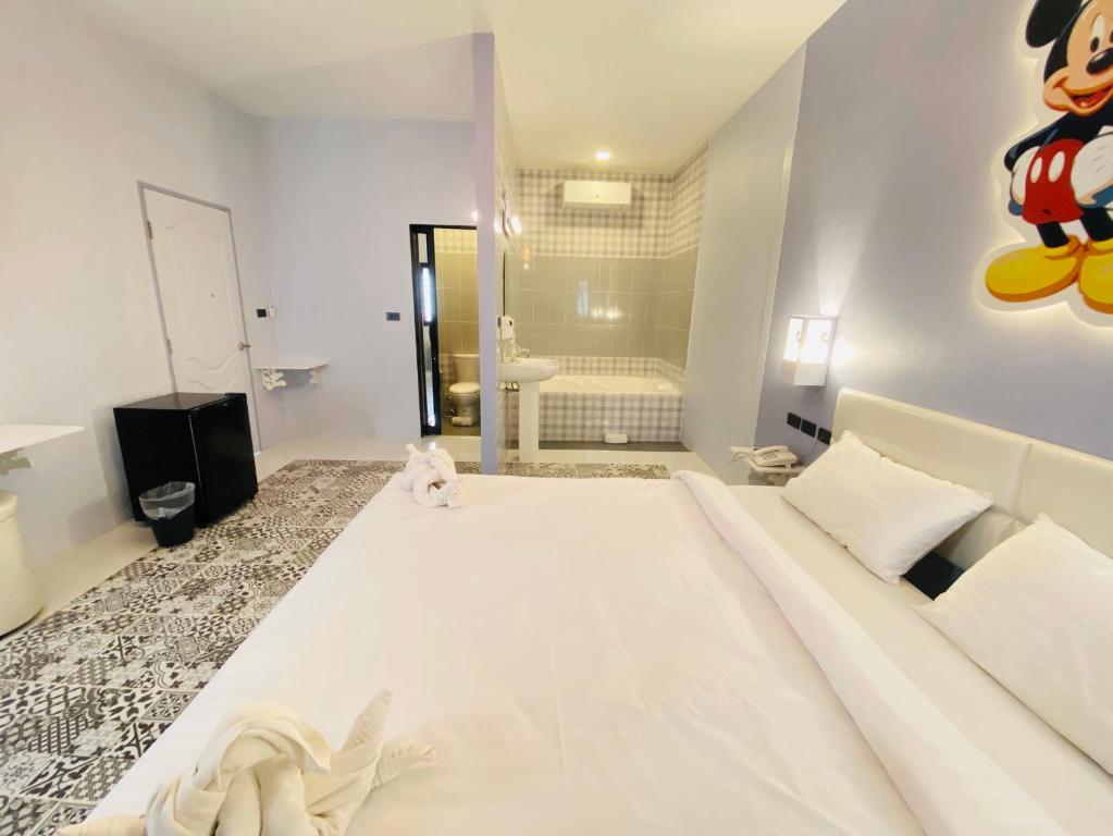 Postel nebo postele na pokoji v ubytování Bedvilla Chiangrai