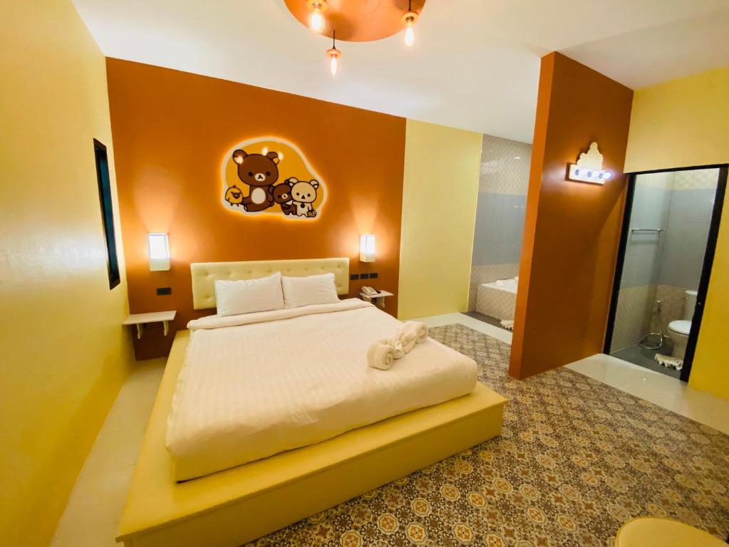 Postel nebo postele na pokoji v ubytování Bedvilla Chiangrai