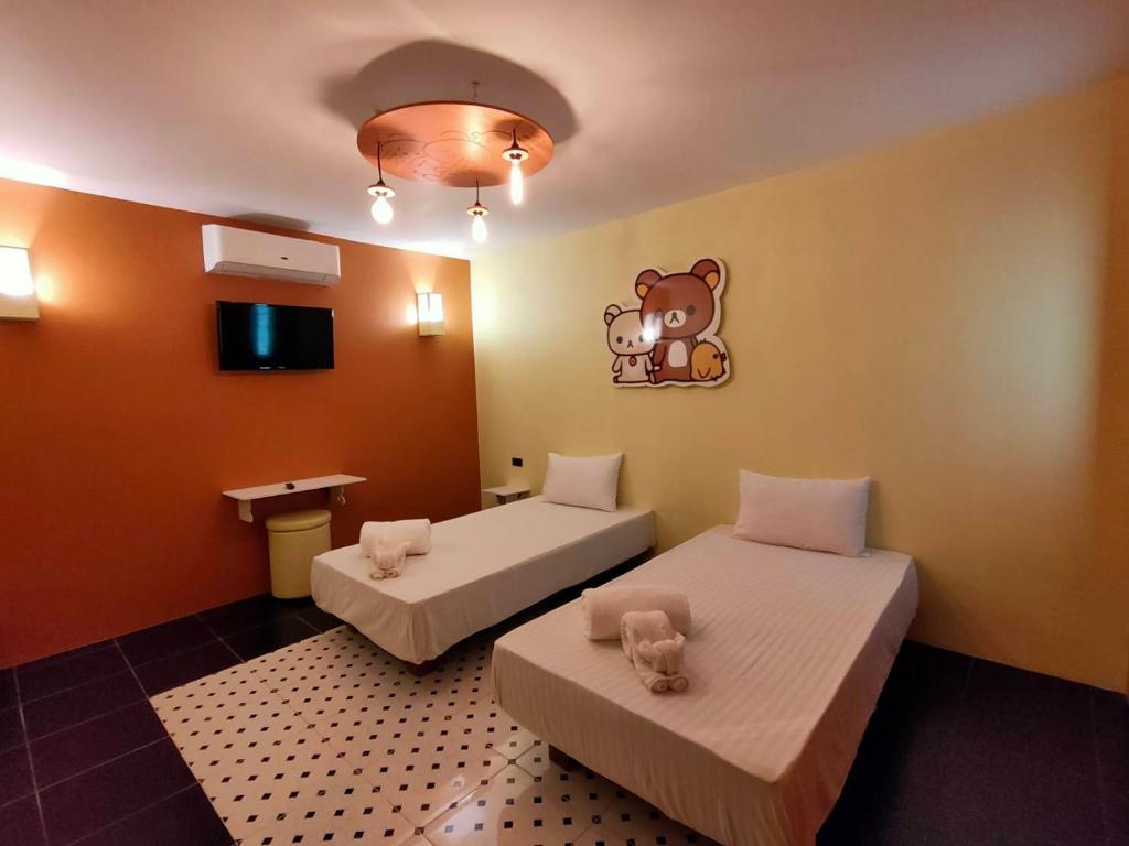 Postel nebo postele na pokoji v ubytování Bedvilla Chiangrai