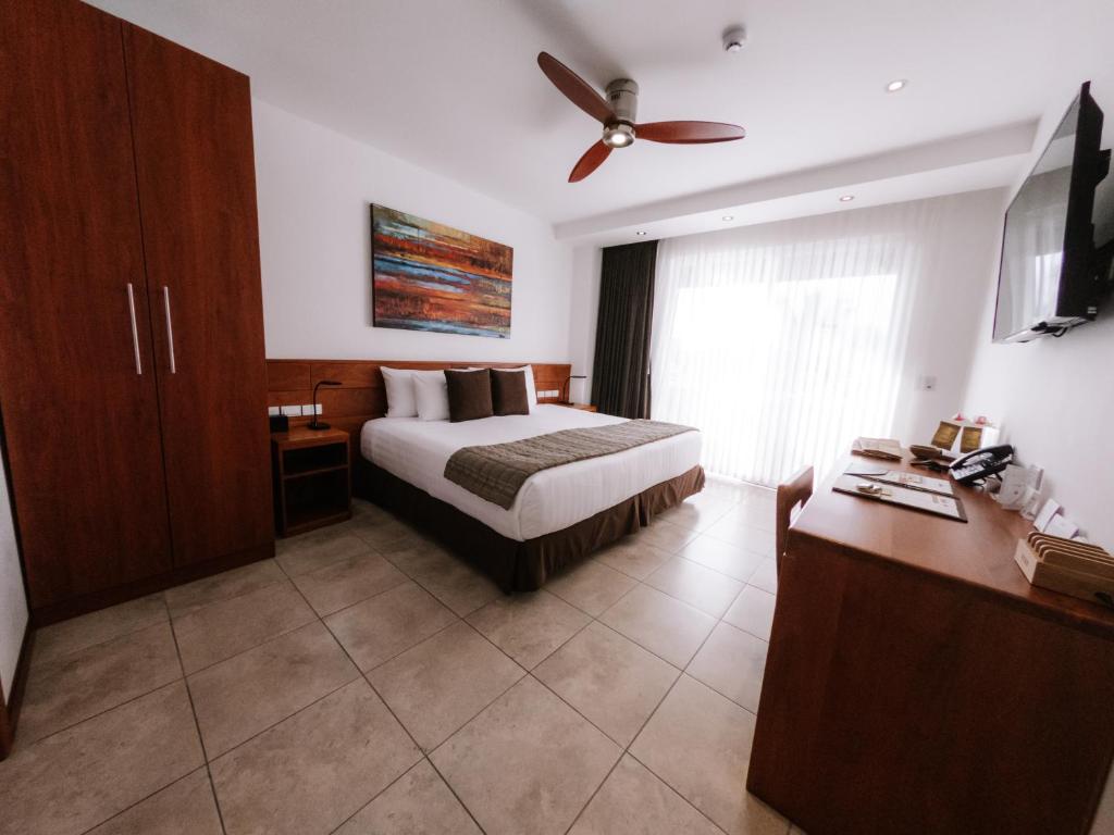 Ein Bett oder Betten in einem Zimmer der Unterkunft Hotel Cucuve