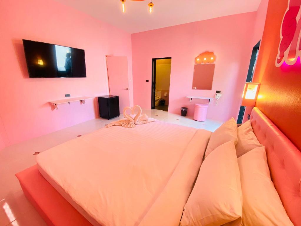 Postel nebo postele na pokoji v ubytování Bedvilla Chiangrai
