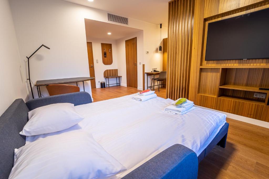 Postel nebo postele na pokoji v ubytování Hestia Hotel Kentmanni