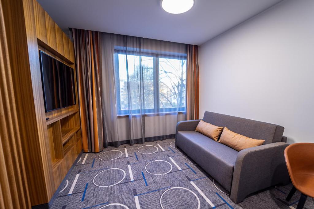 TV a/nebo společenská místnost v ubytování Hestia Hotel Kentmanni