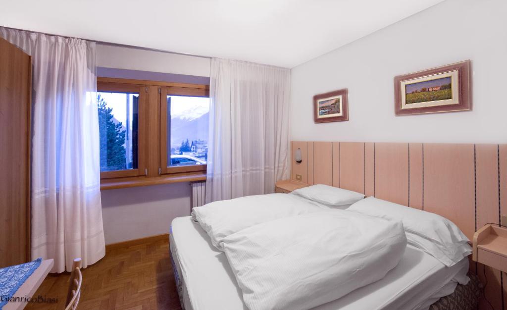 Postel nebo postele na pokoji v ubytování Hotel Terme