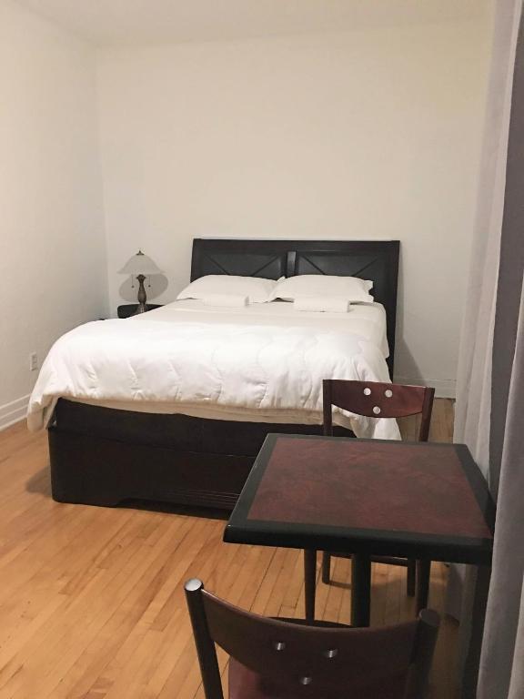 Postel nebo postele na pokoji v ubytování Hotel Mini Inc