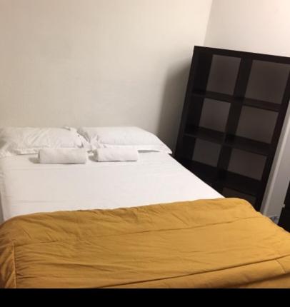 Postel nebo postele na pokoji v ubytování Hotel Mini Inc