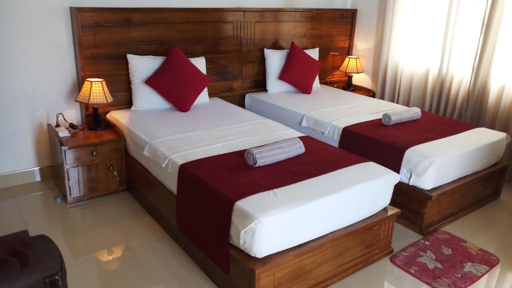 Postel nebo postele na pokoji v ubytování Shani Residence Kandy