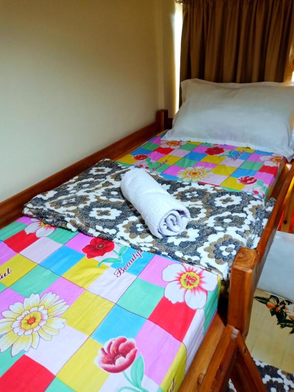 Uma cama ou camas num quarto em Aquing's Place