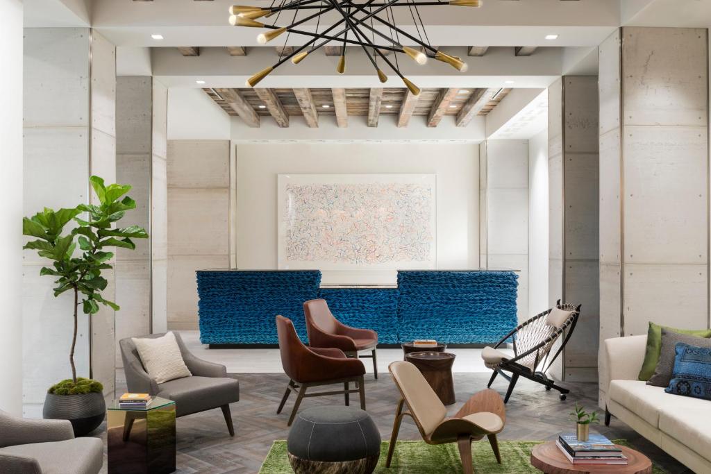 a living room with chairs and a couch at Kimpton Aertson Hotel, an IHG Hotel in Nashville