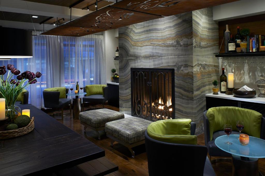 a restaurant with a fireplace and a table and chairs at Kimpton Hotel Vintage Seattle, an IHG Hotel in Seattle