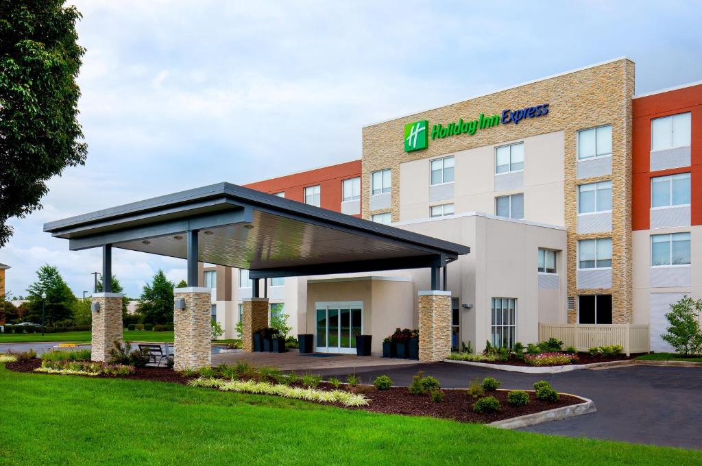 a rendering of a hotel with a building at Holiday Inn Express Chesapeake - Norfolk by IHG in Chesapeake