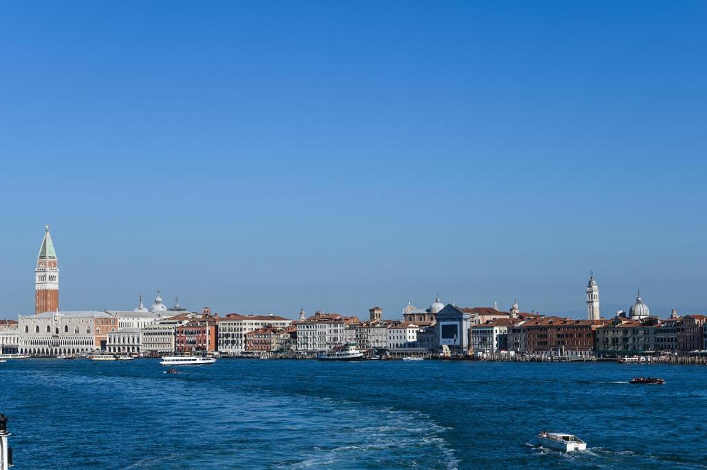a view of a city from a boat in the water at A Tribute To Music Residenza in Venice