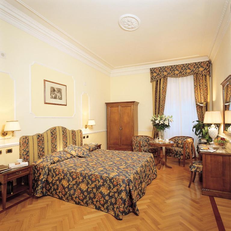 Voodi või voodid majutusasutuse Hotel Cellini toas