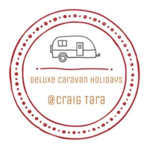 a logo for a caravan holidays in a camps trap at Deluxe Caravan Holidays at Craig Tara in Ayr