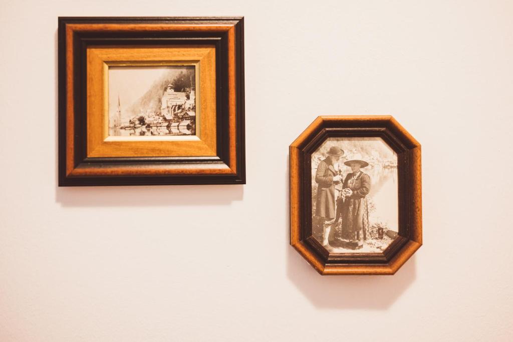 two framed photographs hanging on a wall at Heritage Hotel Hallstatt in Hallstatt