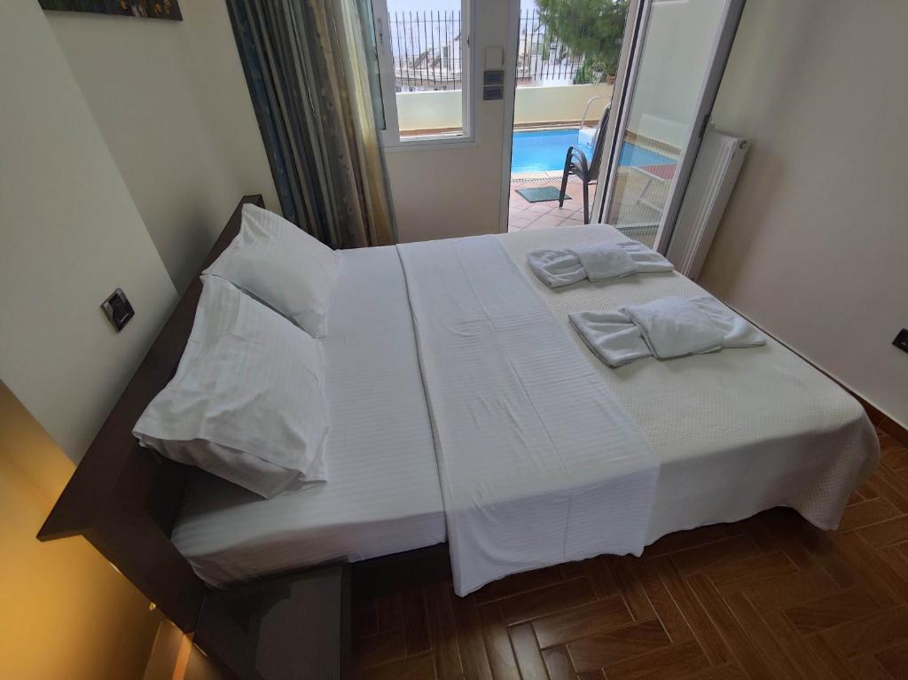 Ένα ή περισσότερα κρεβάτια σε δωμάτιο στο Private pool & Panorama View on Athens center Hill