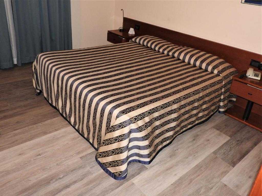 Posteľ alebo postele v izbe v ubytovaní Albergo Centrale