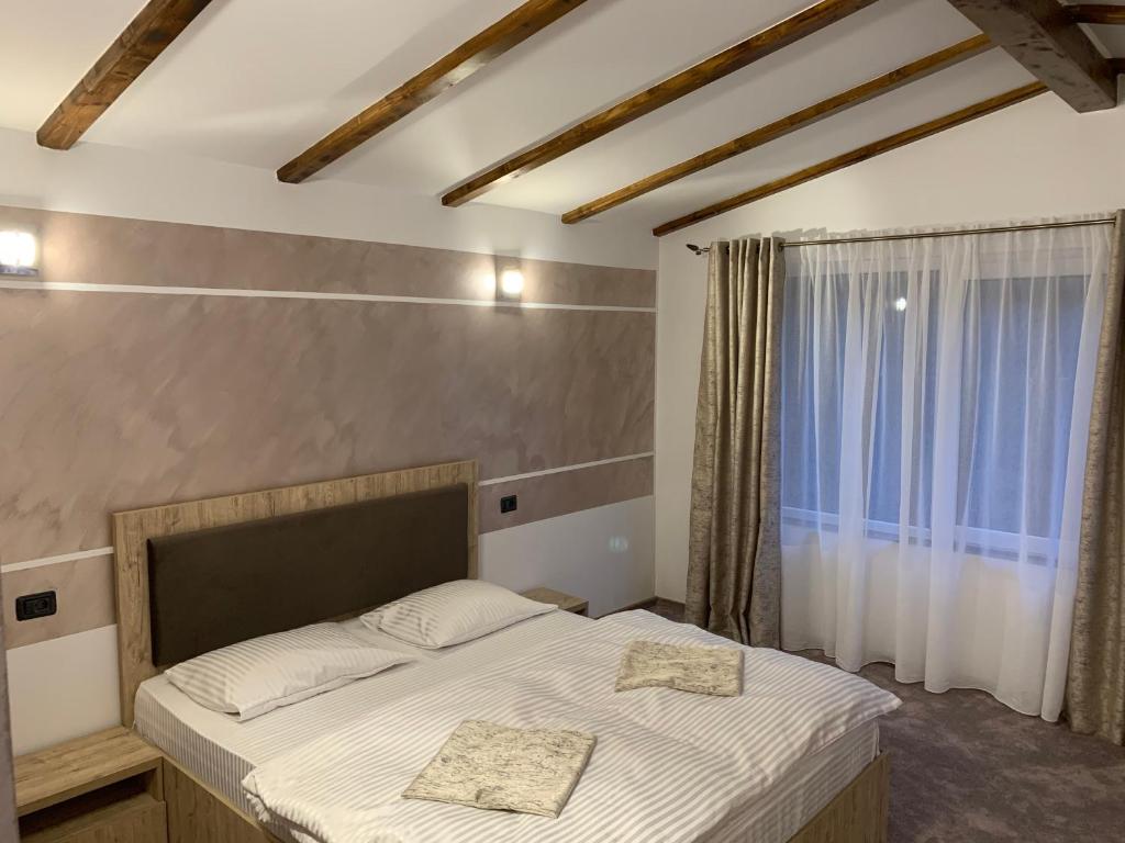 Katil atau katil-katil dalam bilik di Casa Perla Nordului