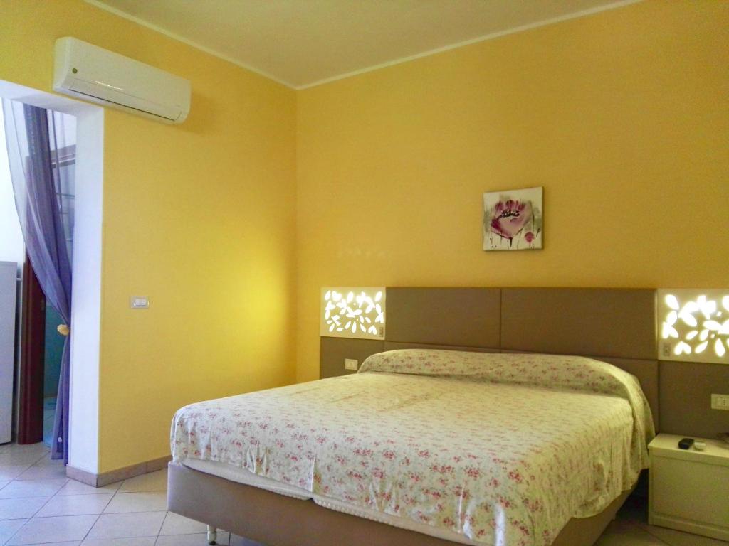 Postel nebo postele na pokoji v ubytování Case Barone di Muro