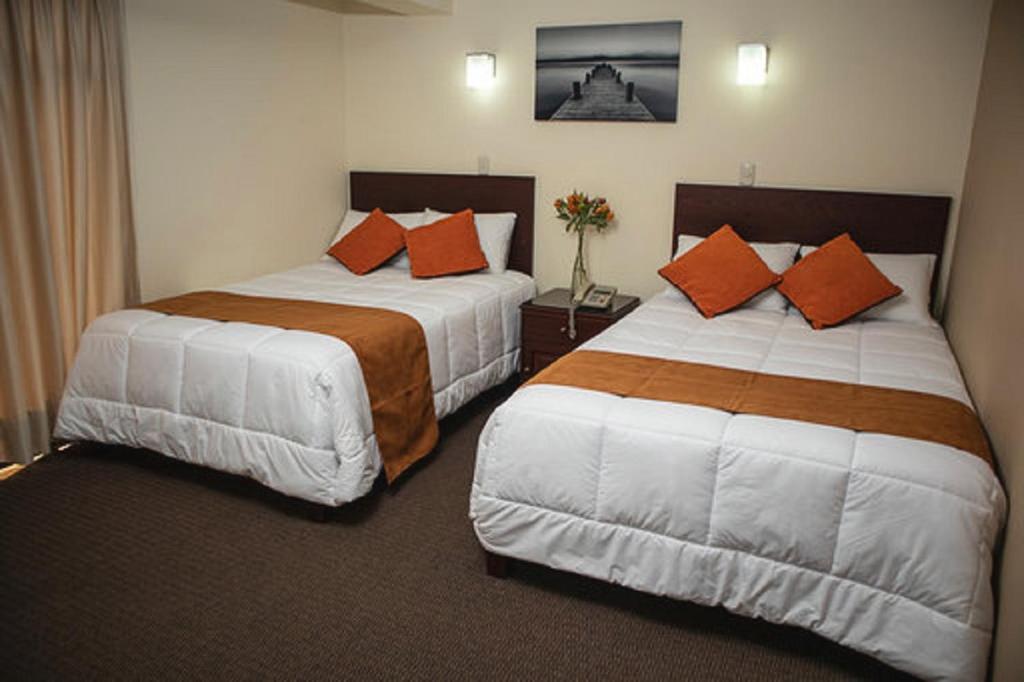 Ένα ή περισσότερα κρεβάτια σε δωμάτιο στο Hotel Ferrua