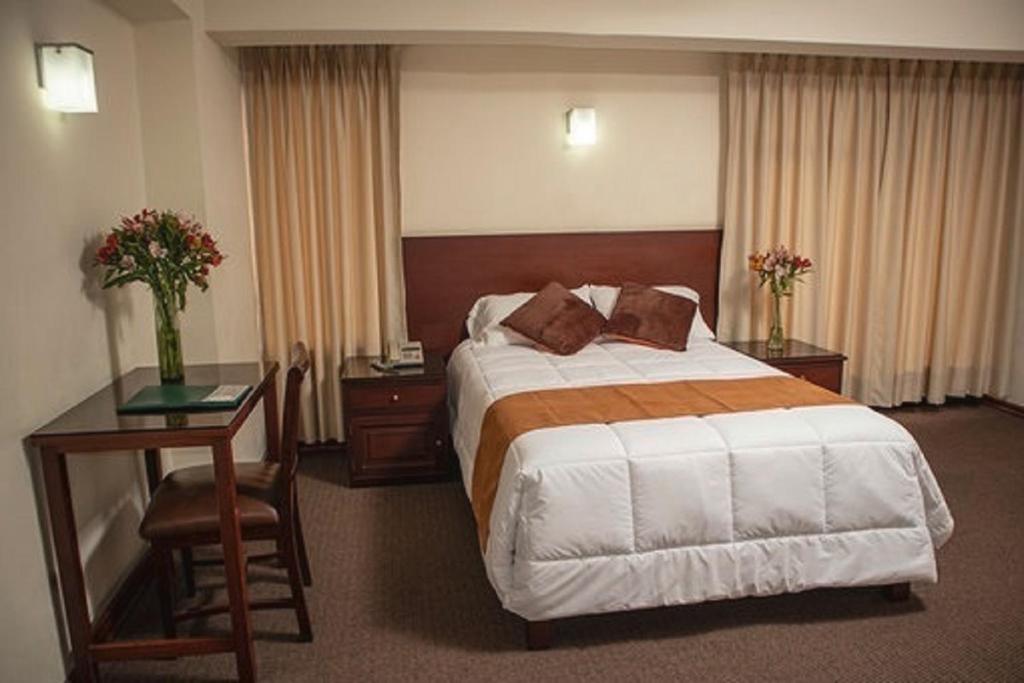 Ένα ή περισσότερα κρεβάτια σε δωμάτιο στο Hotel Ferrua