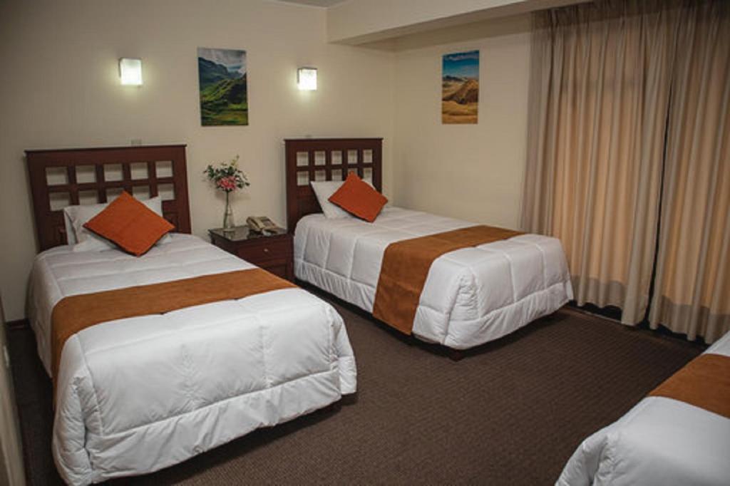 Ένα ή περισσότερα κρεβάτια σε δωμάτιο στο Hotel Ferrua