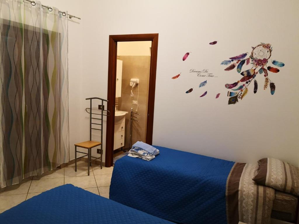Posteľ alebo postele v izbe v ubytovaní La Casetta
