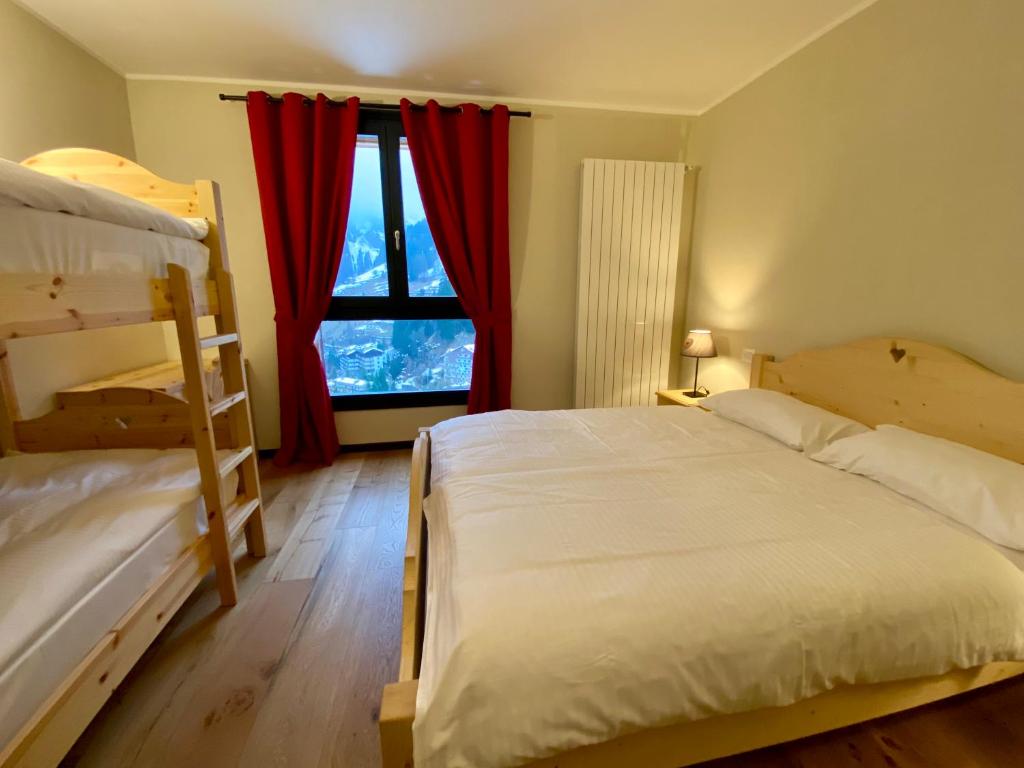 Postel nebo postele na pokoji v ubytování Chalet Ronchi - Foppolo Ski