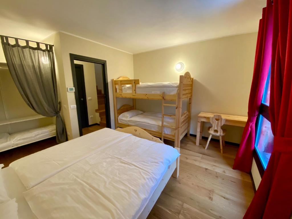 Postel nebo postele na pokoji v ubytování Chalet Ronchi - Foppolo Ski