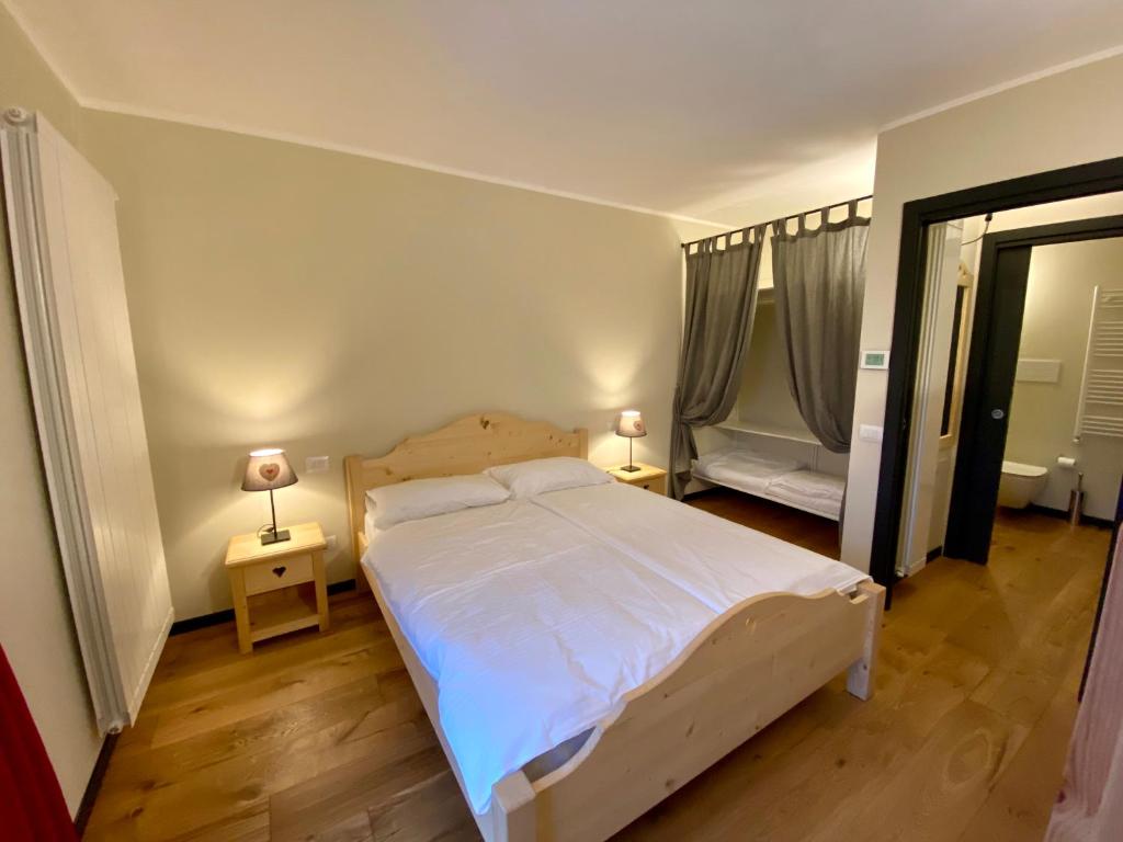 Postel nebo postele na pokoji v ubytování Chalet Ronchi - Foppolo Ski