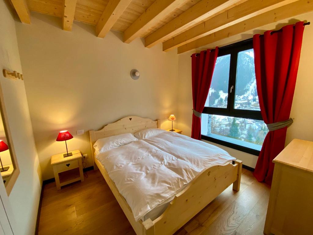 Postel nebo postele na pokoji v ubytování Chalet Ronchi - Foppolo Ski