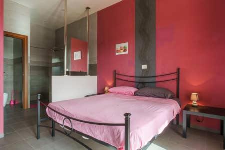 Łóżko lub łóżka w pokoju w obiekcie Villa Vacanze Giuseppe